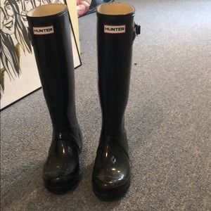 Tall black glossy hunter rain boots